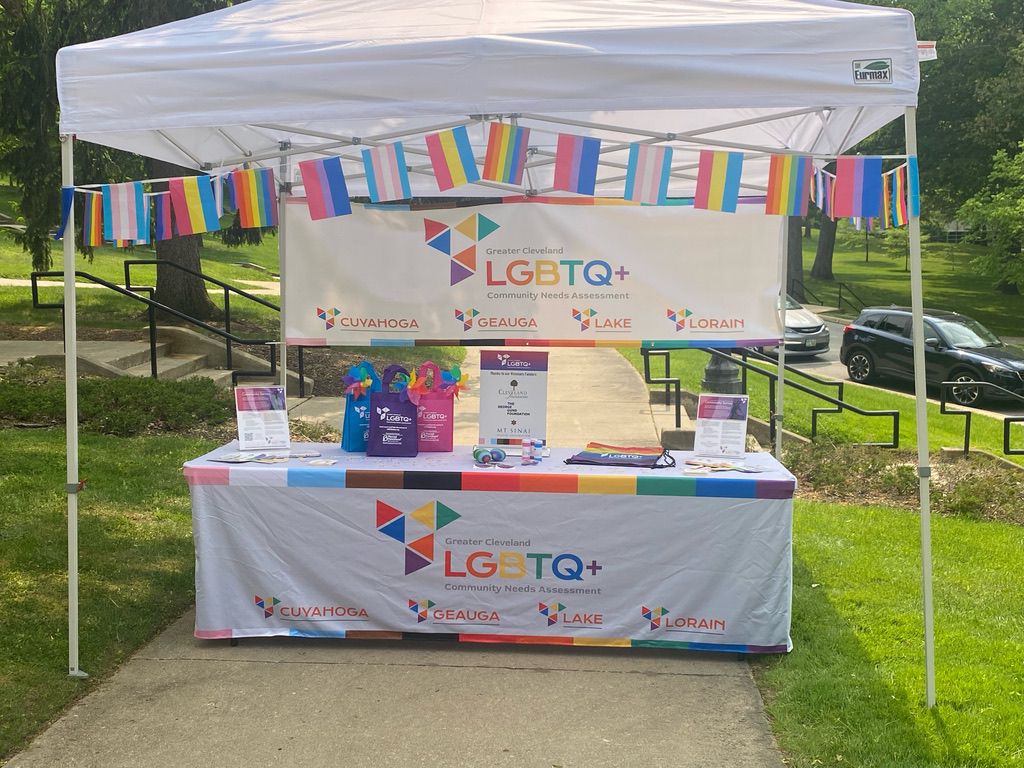 a colorfully decorated booth for Pride in the CLE Fest